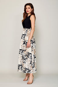 Maxi vestido elegante color negro con falda estampada