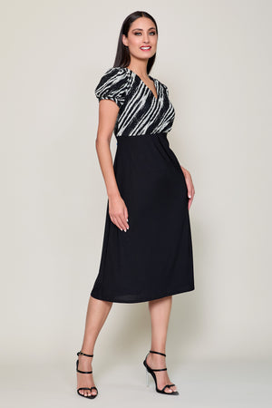 Vestido elegante con estampado superior y falda negra