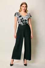 Cargar imagen en el visor de la galería, Jumpsuit elegante color negro estampado con cinturón