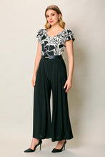 Cargar imagen en el visor de la galería, Jumpsuit elegante color negro estampado con cinturón