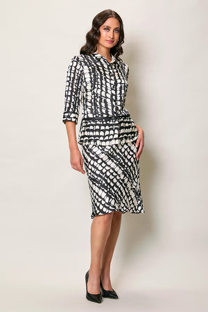 Conjunto negro elegante estampado con falda y cinturón